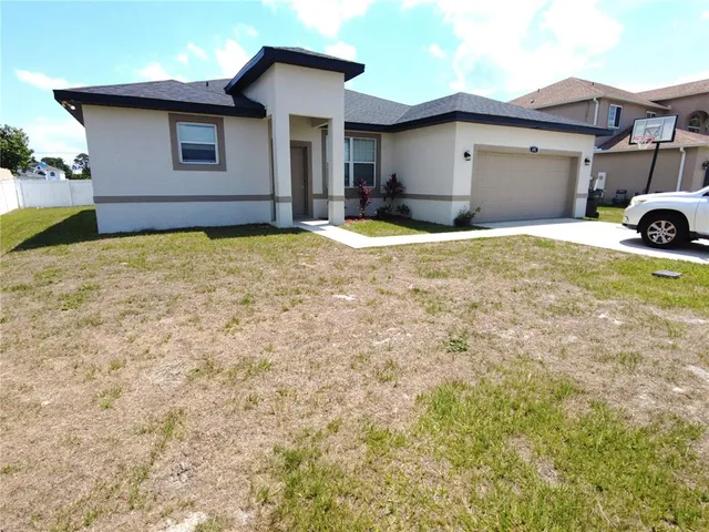 a house with yard in front of it