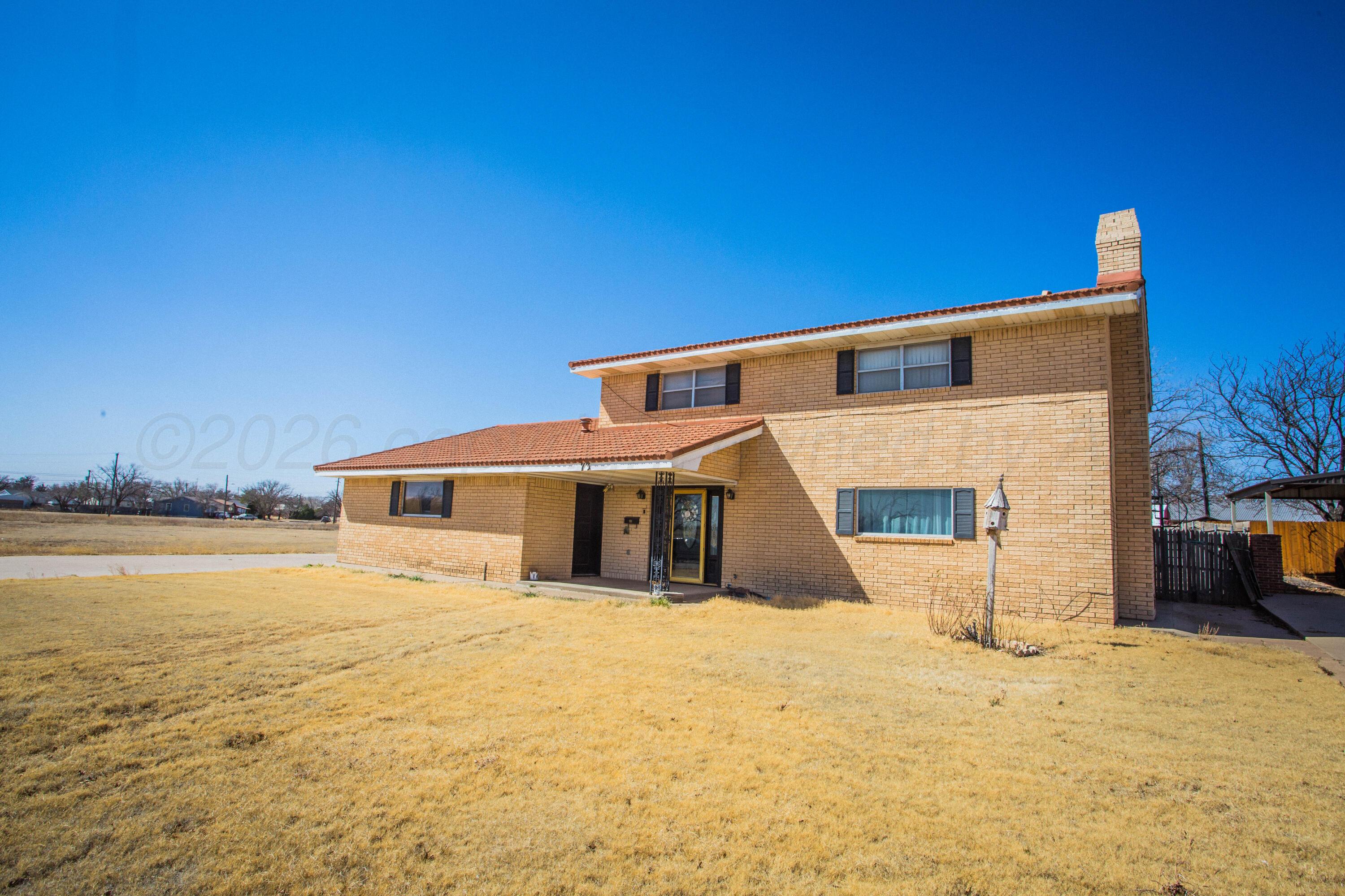 73 Houston Road Tulia, TX 79088 - Photo 1 of 55 a front view of a house with a yard