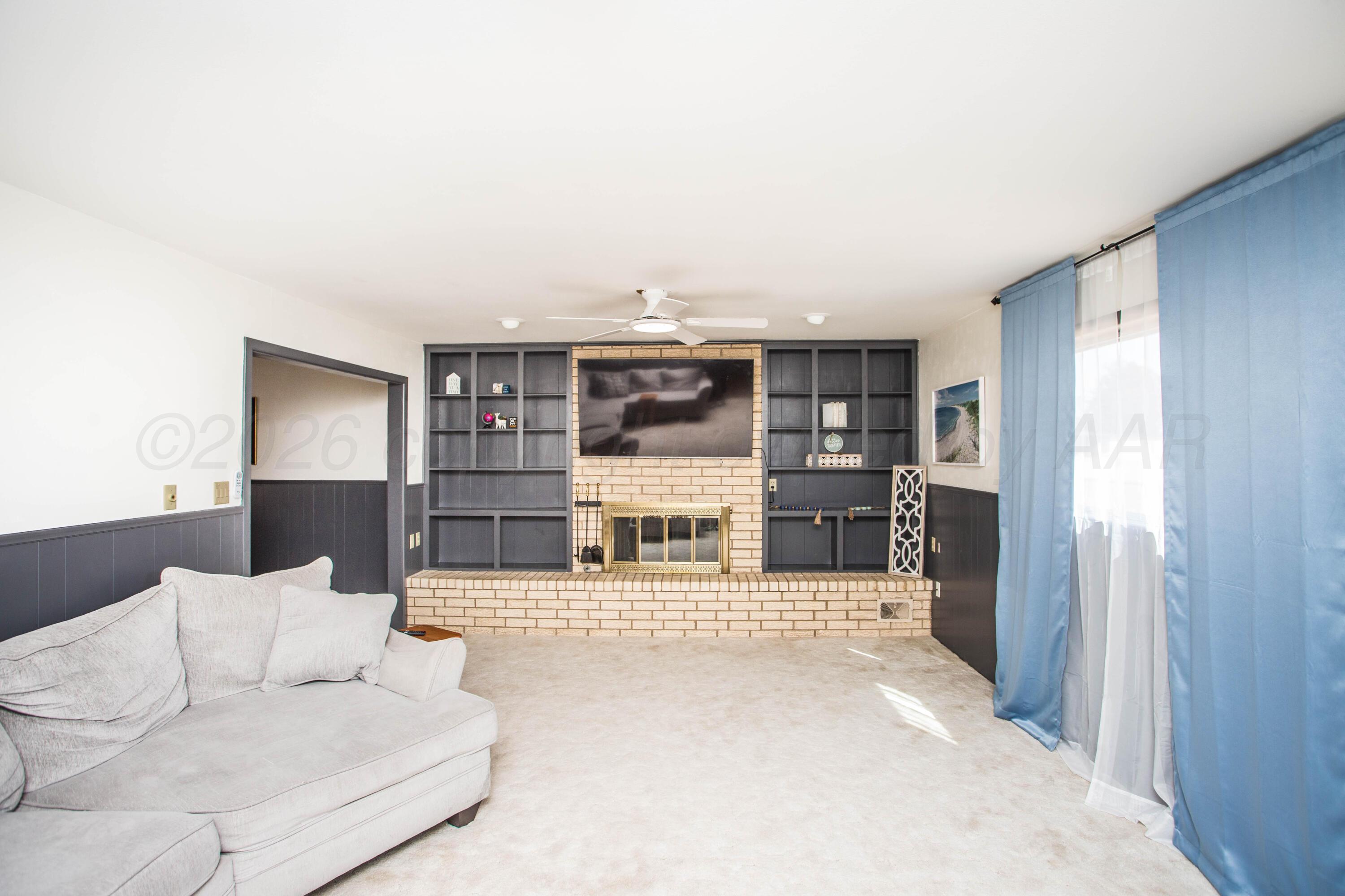 73 Houston Road Tulia, TX 79088 - Photo 11 of 55 a living room with furniture and a large window