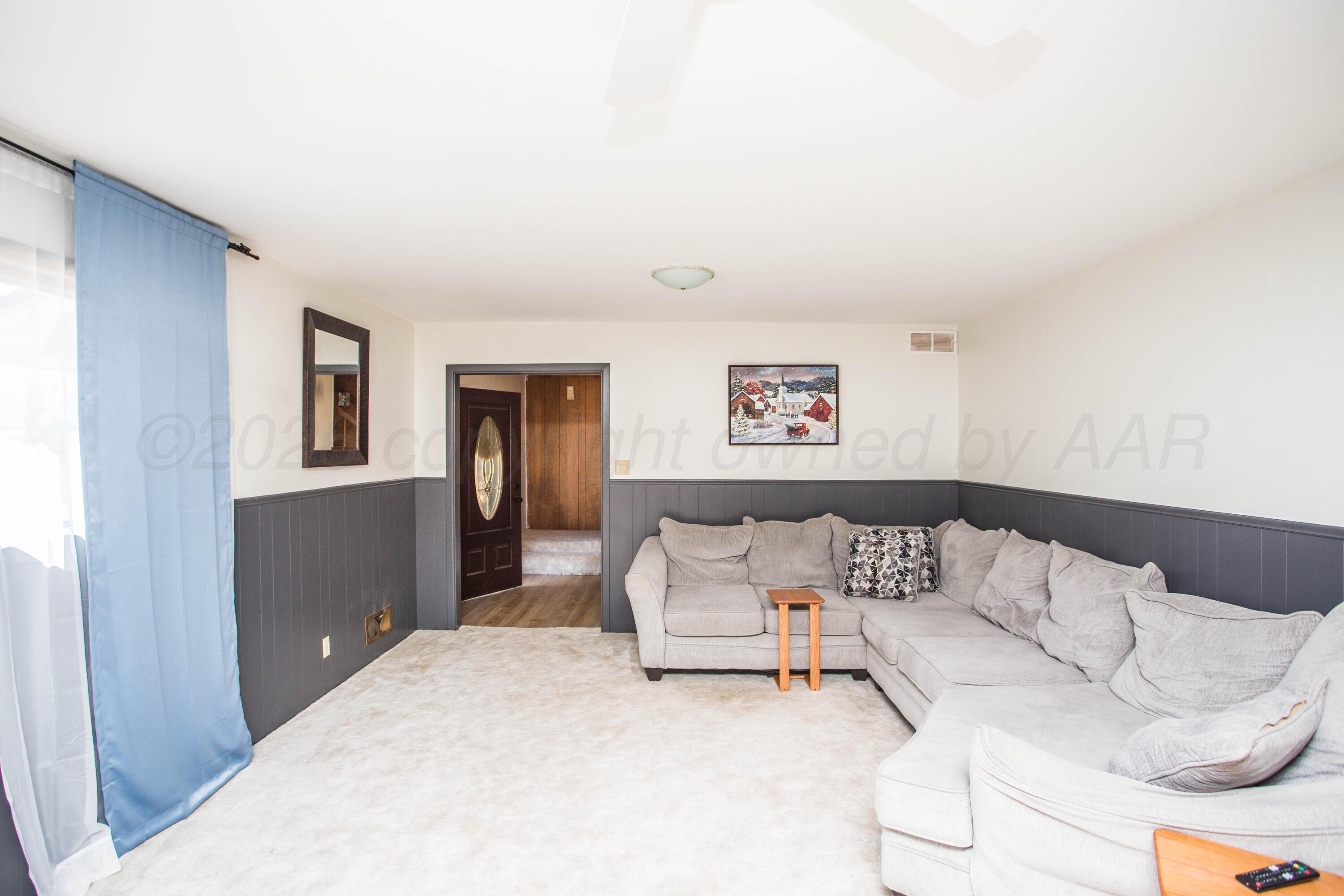 73 Houston Road Tulia, TX 79088 - Photo 12 of 55 a living room with furniture and a window