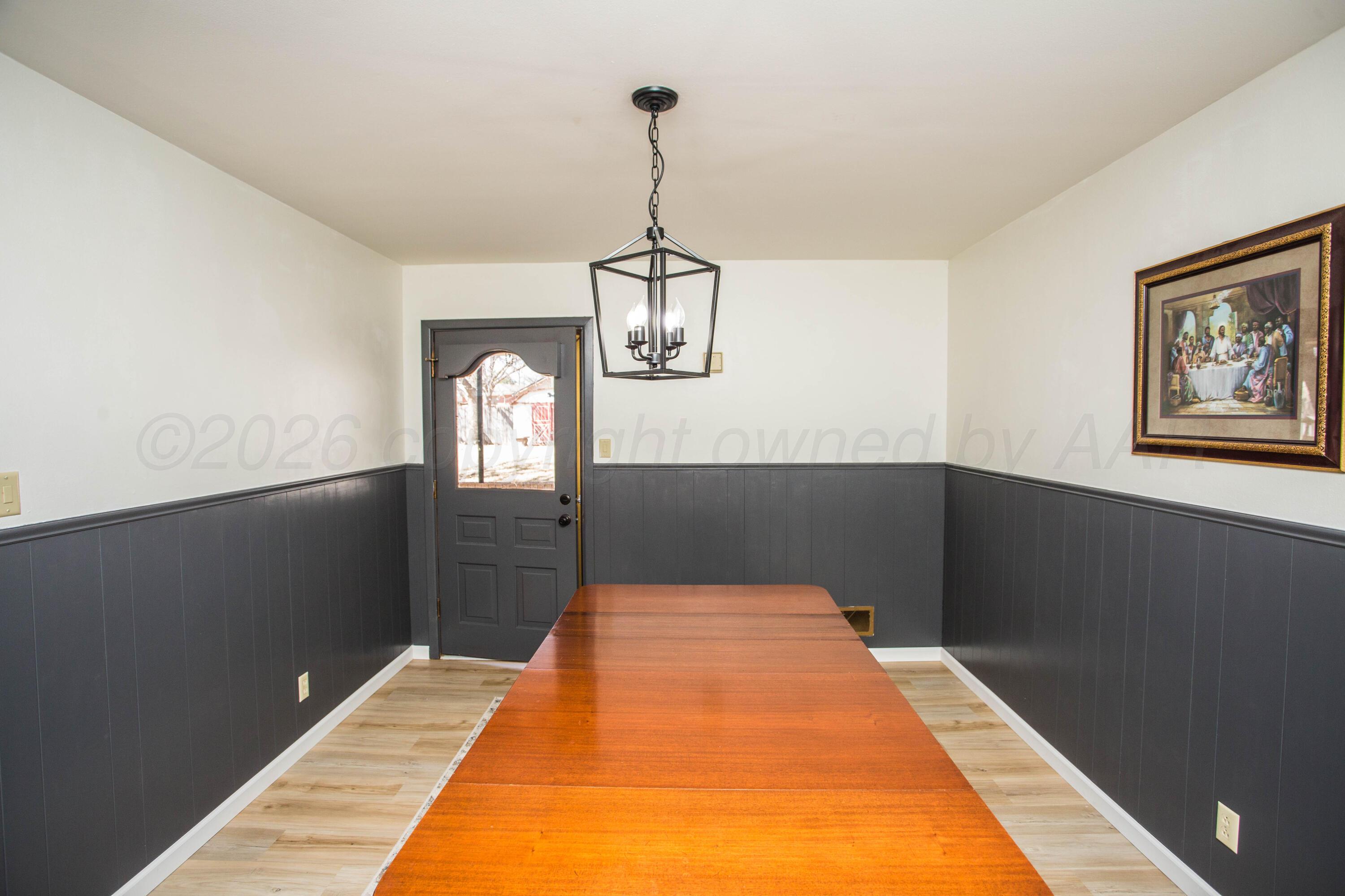 73 Houston Road Tulia, TX 79088 - Photo 16 of 55 a hallway with a wooden floor
