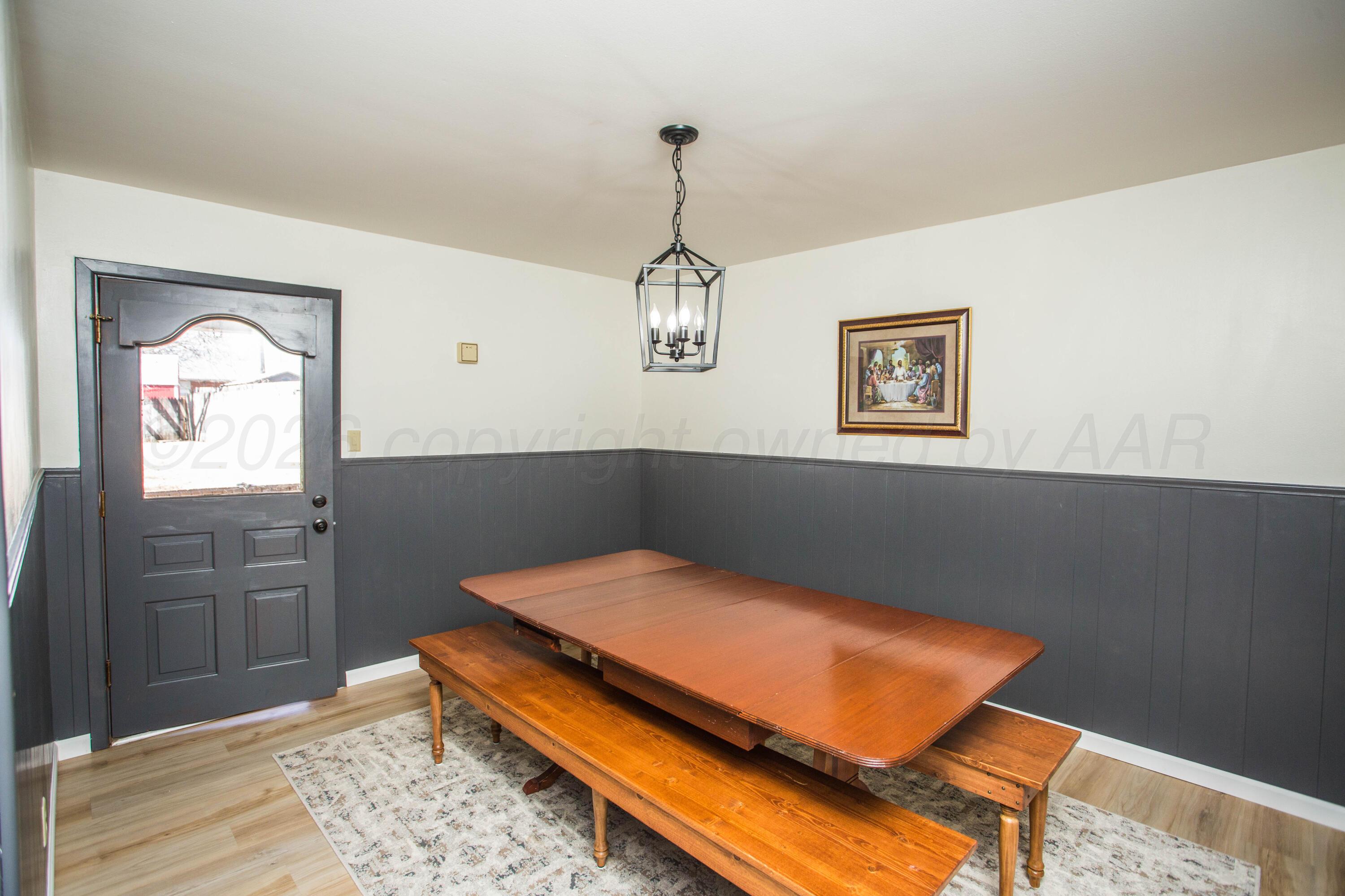 73 Houston Road Tulia, TX 79088 - Photo 17 of 55 a bedroom with a bed and wooden floor