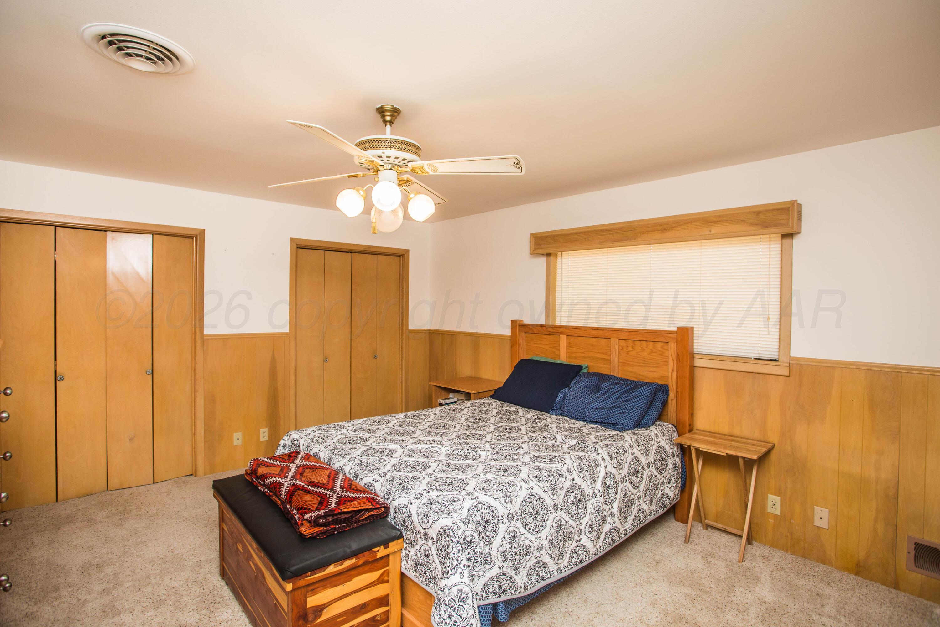 73 Houston Road Tulia, TX 79088 - Photo 25 of 55 a bedroom with a bed dresser and a window