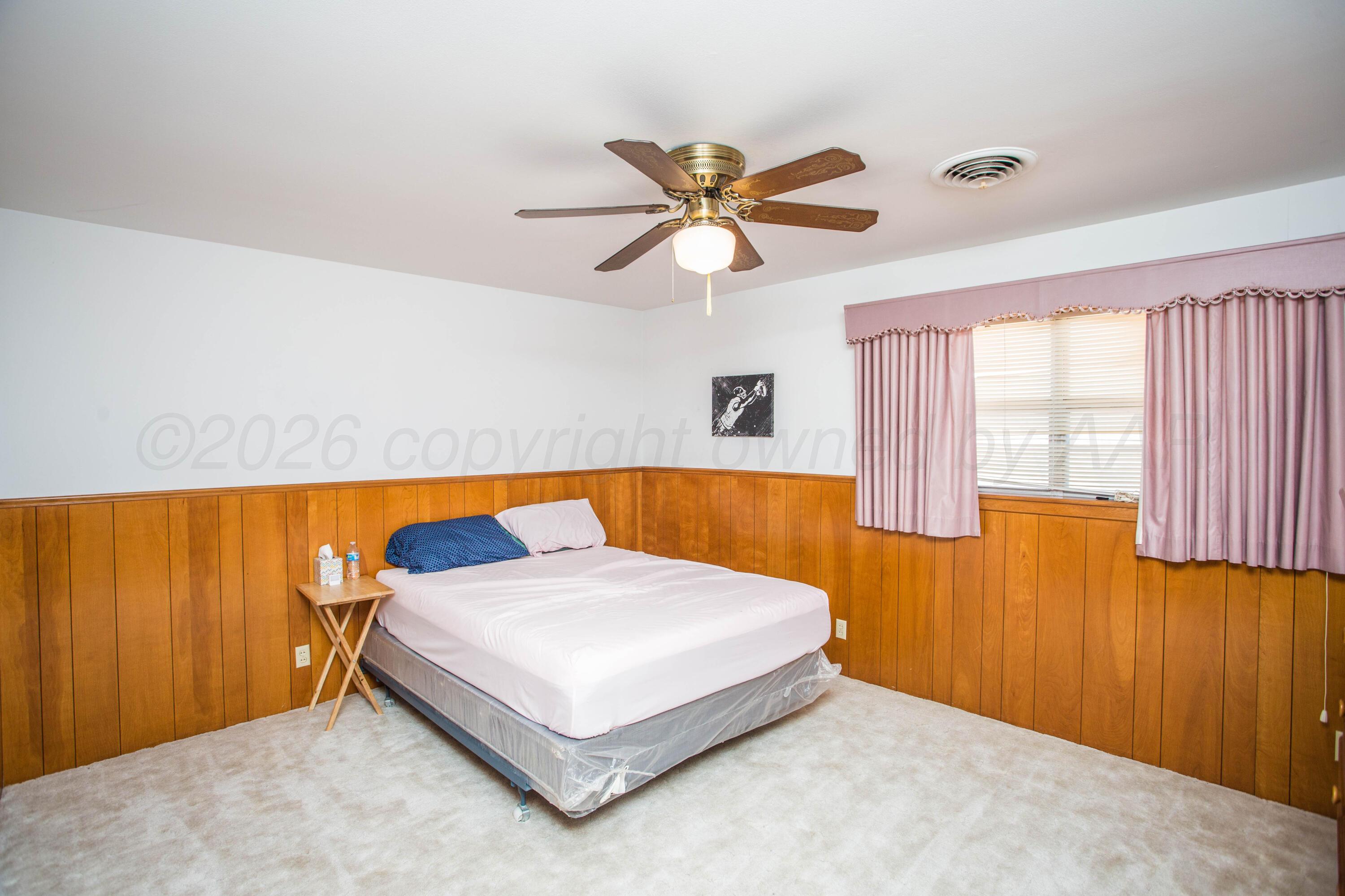 73 Houston Road Tulia, TX 79088 - Photo 33 of 55 a bedroom with a bed and a window