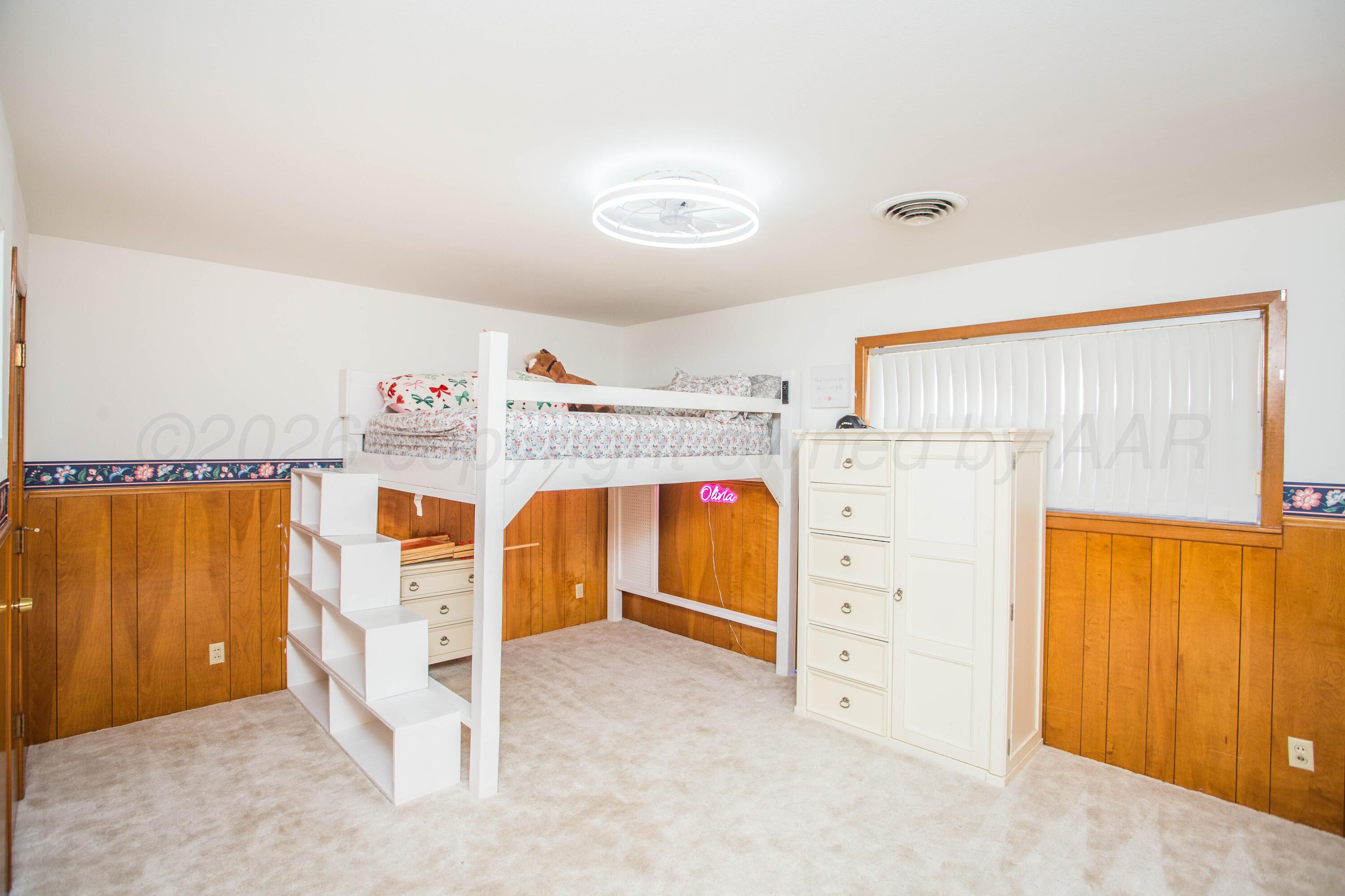 73 Houston Road Tulia, TX 79088 - Photo 42 of 55 a view of a bedroom with window and cabinet