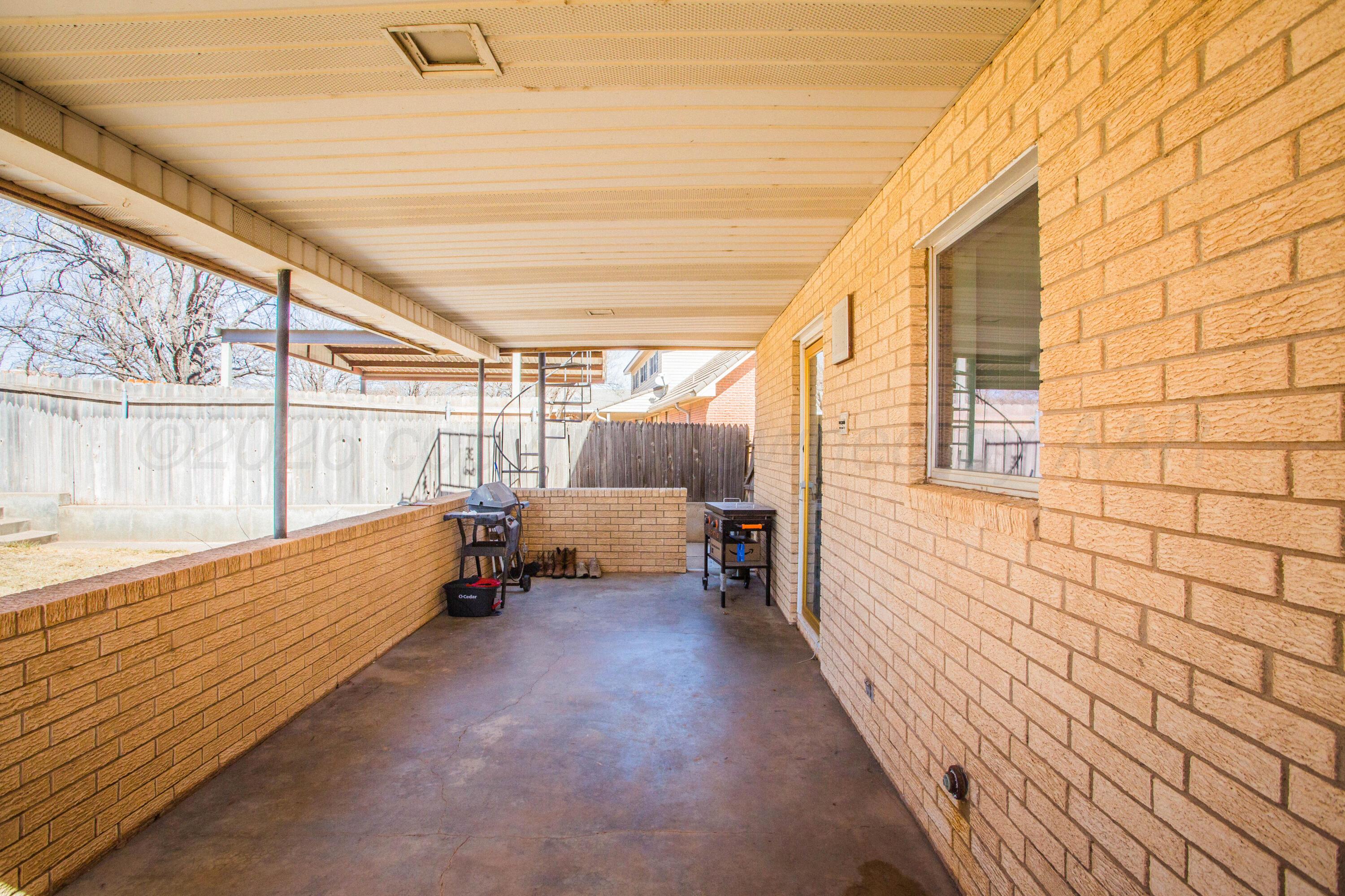 73 Houston Road Tulia, TX 79088 - Photo 52 of 55 a view of a porch with wooden floor and outdoor seating