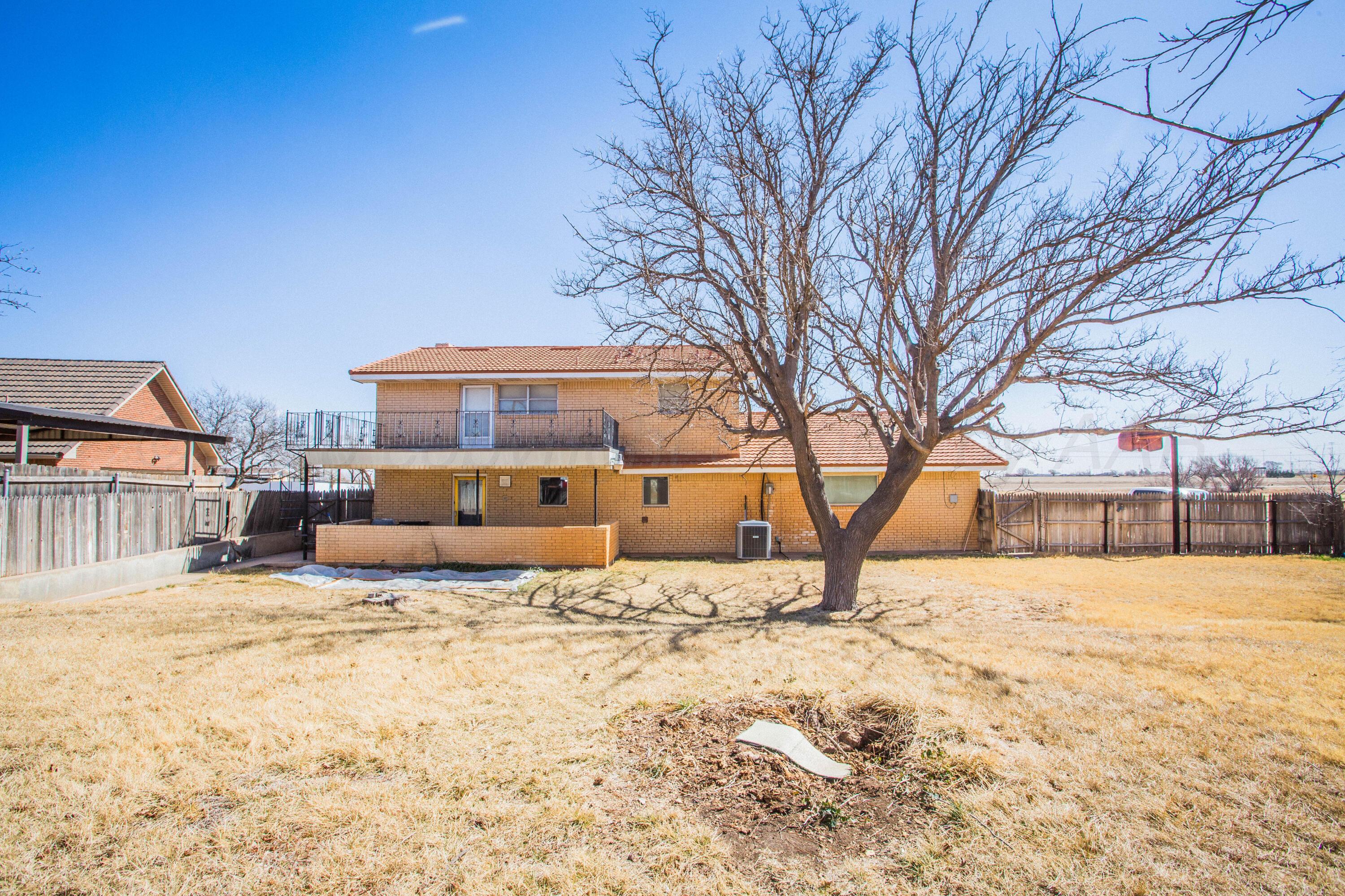 73 Houston Road Tulia, TX 79088 - Photo 54 of 55 a backyard of a house with large trees