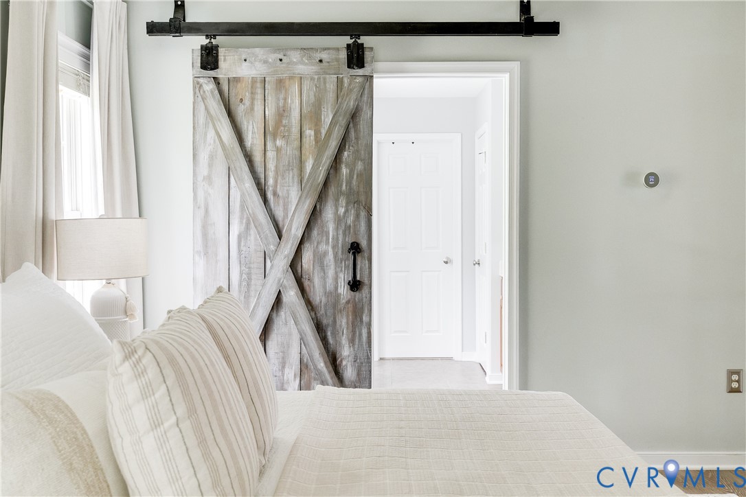 4907 Winding Branch Road Moseley, VA 23120 - Photo 36 of 53 Sliding barn door with distressed wood finish and