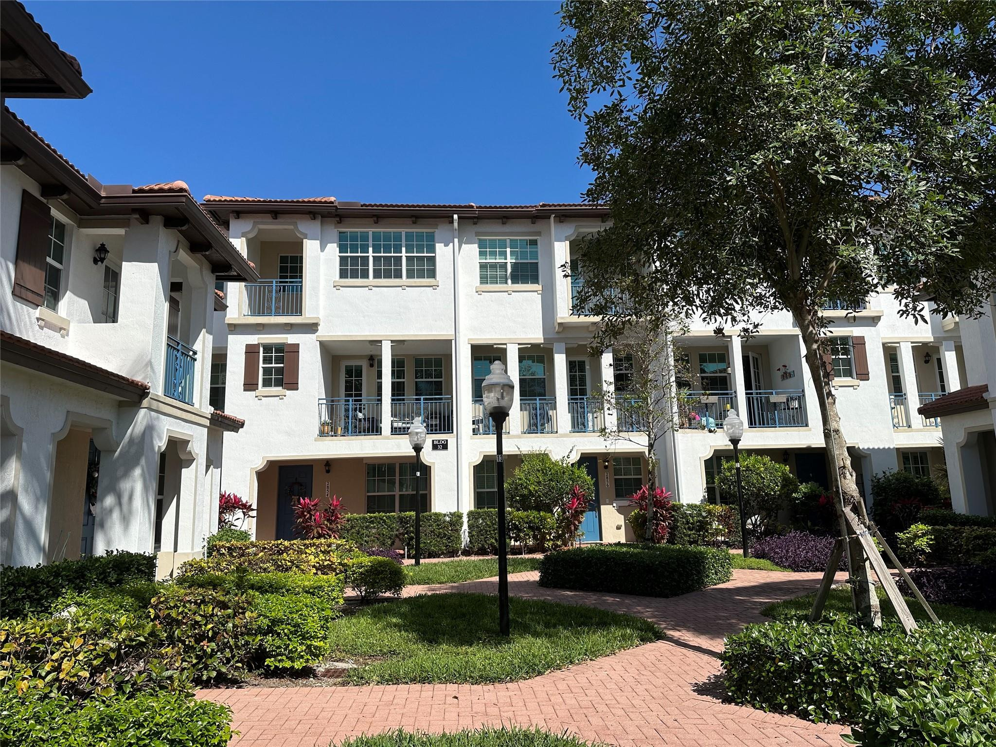 2854 Southwest 119th Road, Unit 2854 Miramar, FL 33025 - Photo 32 of 43 Front Exterior of Townhouses
