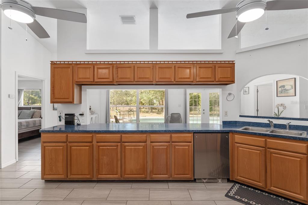 9128 Northwest 238 Street Alachua, FL 32615 - Photo 14 of 32 a kitchen with a sink and cabinets