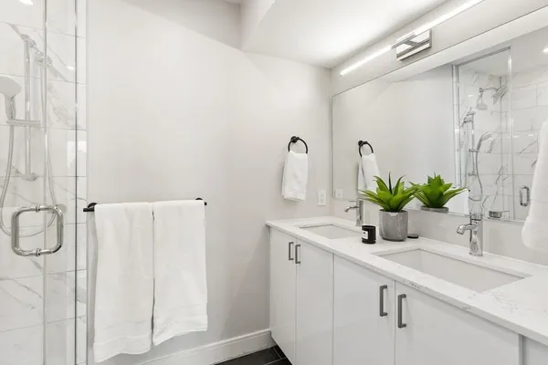 a view of a hallway with washer and dryer
