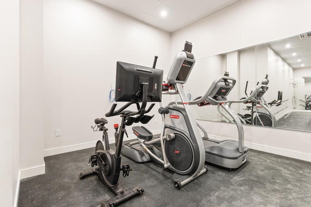 398 Cambridge Street, Unit 502 Boston, MA 02134 - Photo 9 of 11 a view of a room with gym equipment