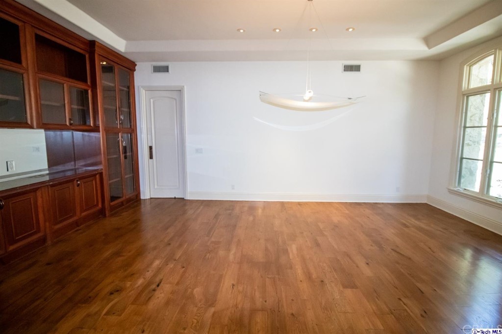 12801 Chalon Road Los Angeles, CA 90049 - Photo 19 of 77 wooden floor in an empty room with a window