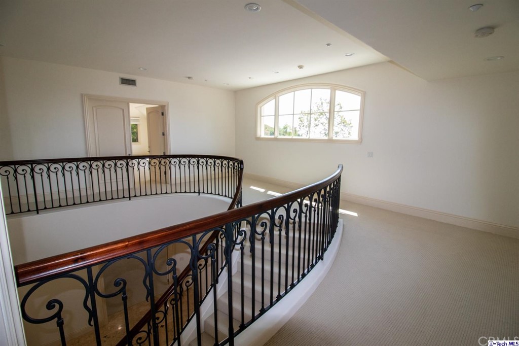 12801 Chalon Road Los Angeles, CA 90049 - Photo 31 of 77 a view of hallway with stairs