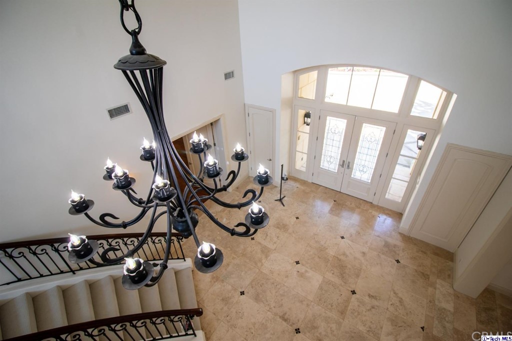 12801 Chalon Road Los Angeles, CA 90049 - Photo 5 of 77 a view of an entryway with wooden floor