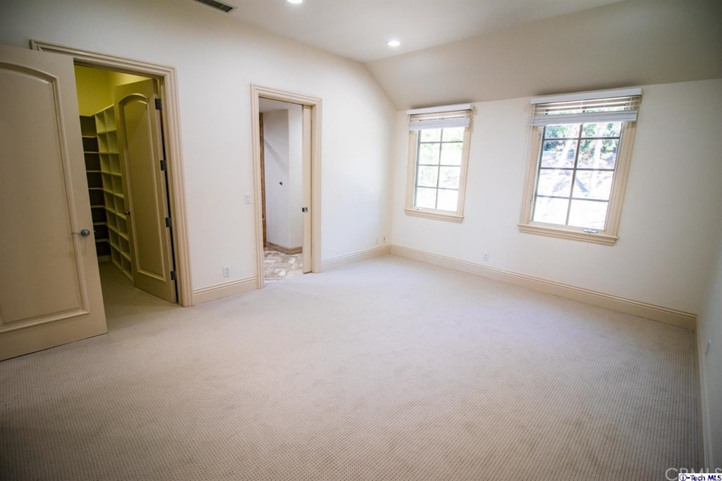 12801 Chalon Road Los Angeles, CA 90049 - Photo 51 of 77 an empty room with windows