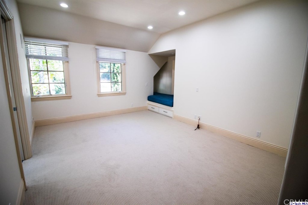 12801 Chalon Road Los Angeles, CA 90049 - Photo 55 of 77 an empty room with windows