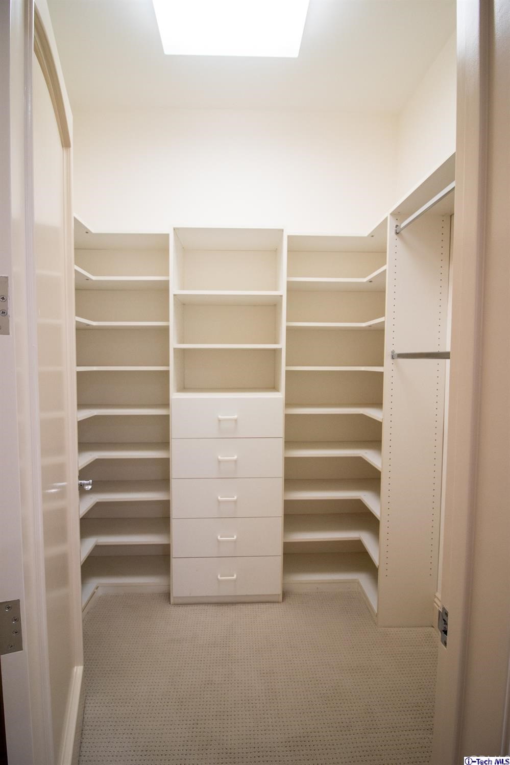 12801 Chalon Road Los Angeles, CA 90049 - Photo 58 of 77 a view of walk in closet with empty racks