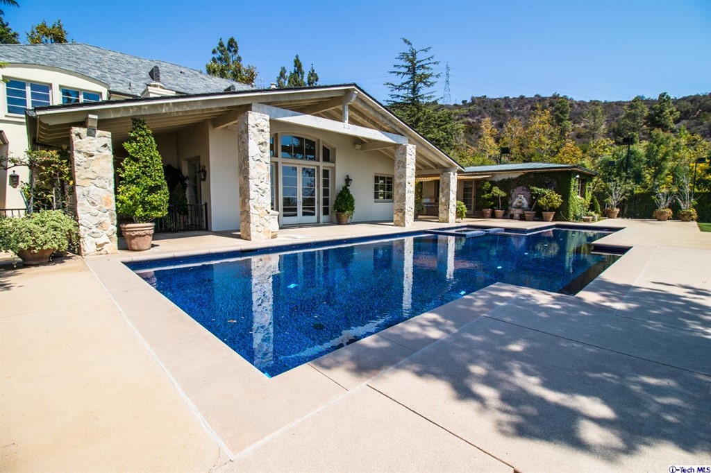12801 Chalon Road Los Angeles, CA 90049 - Photo 60 of 77 a view of a house with roof deck