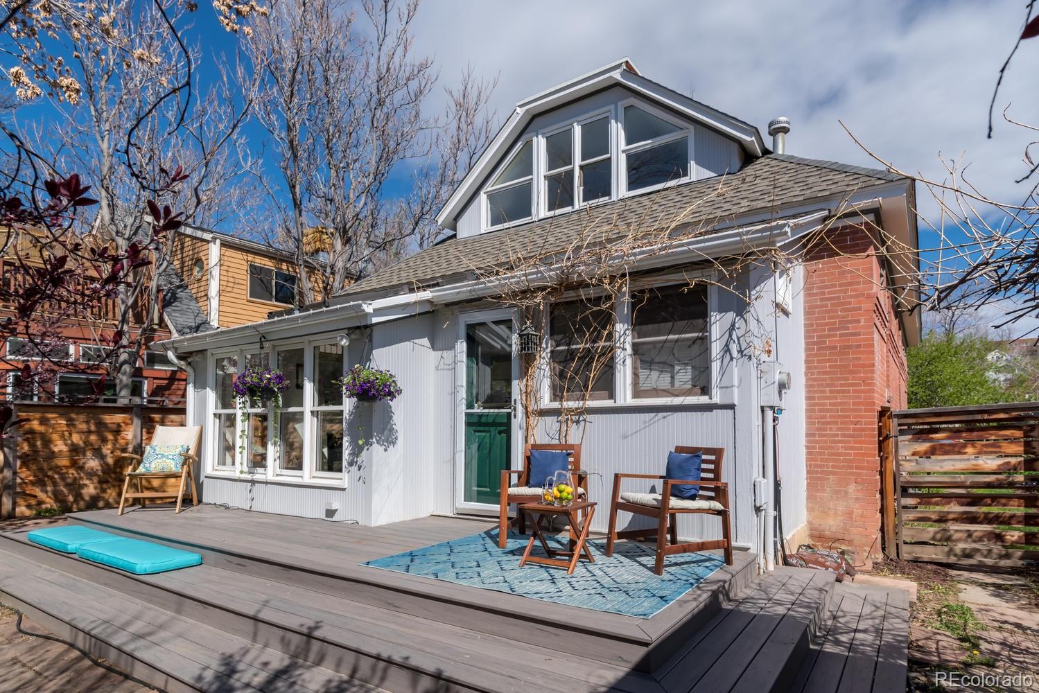 2120 Mapleton Avenue Boulder, CO 80304 - Photo 22 of 29 a front view of a house with garden