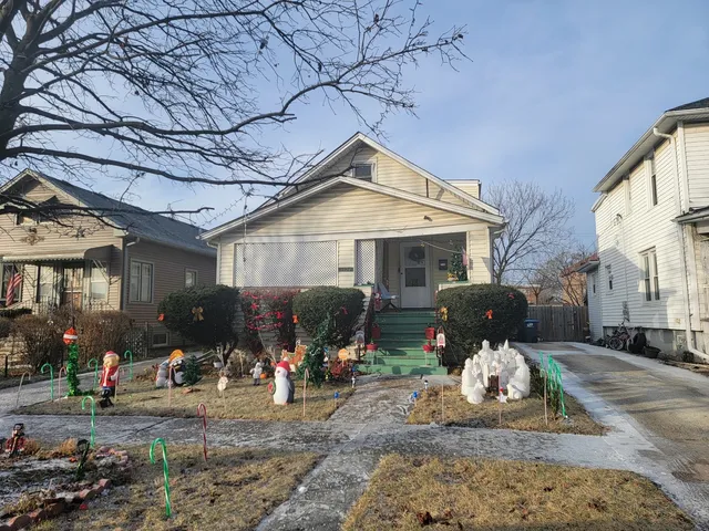 a front view of a house with sitting area