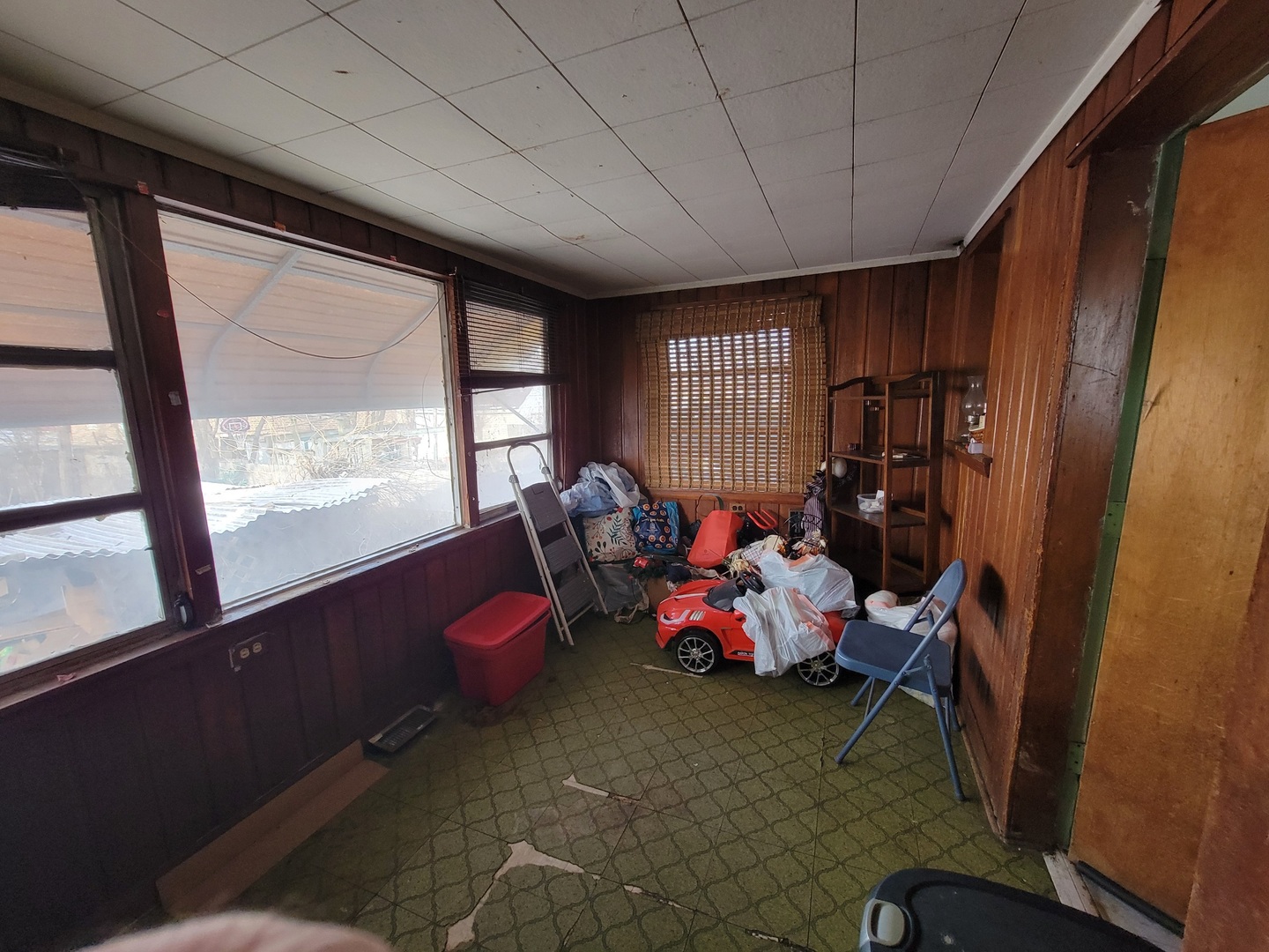2124 South 3rd Avenue Maywood, IL 60153 - Photo 12 of 26 a living room with furniture a window and gym cycle
