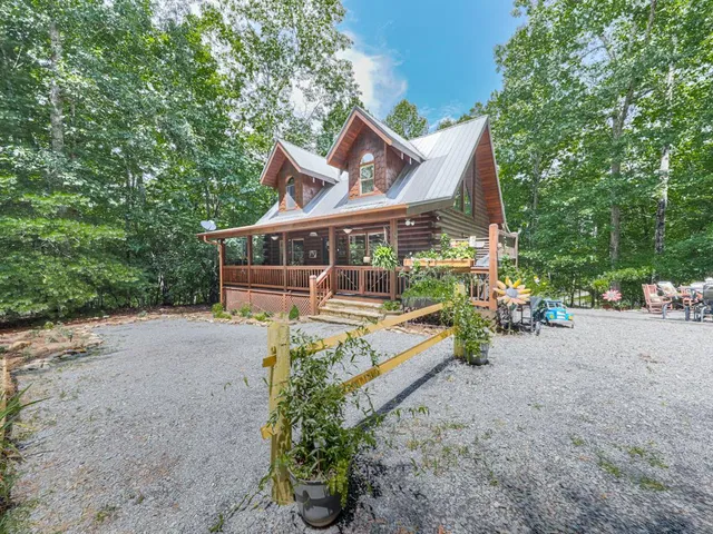 a view of a house with a yard and balcony