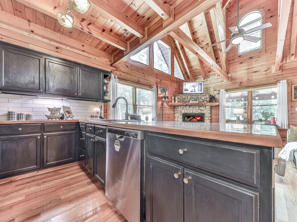 34 Amber Way Morganton, GA 30560 - Photo 12 of 39 a kitchen with stainless steel appliances granite countertop a sink stove and cabinets