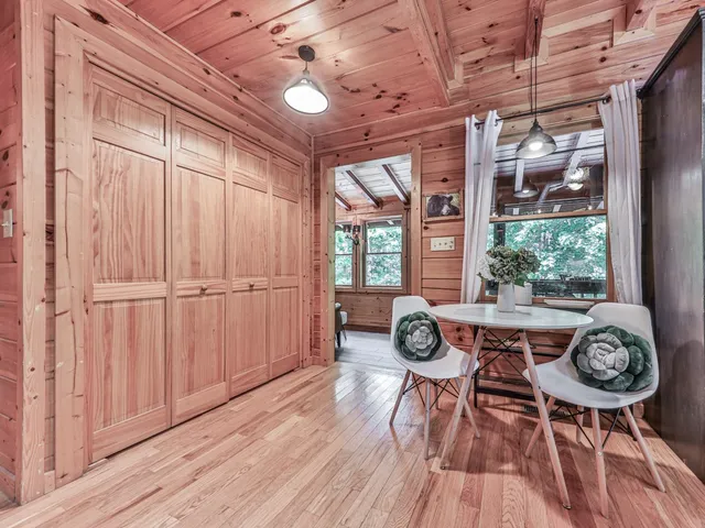 a view of a dining room with furniture window and wooden floor