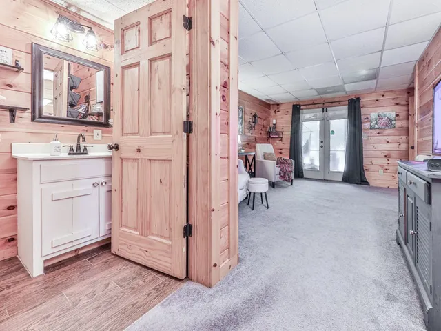 a bathroom with a sink toilet a mirror and shower