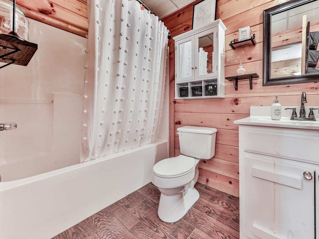34 Amber Way Morganton, GA 30560 - Photo 25 of 39 a bathroom with a sink toilet a mirror and shower