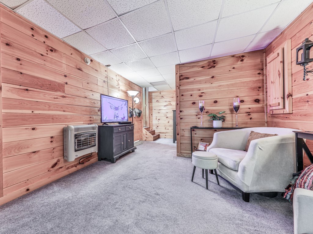 34 Amber Way Morganton, GA 30560 - Photo 26 of 39 a living room with furniture and a flat screen tv