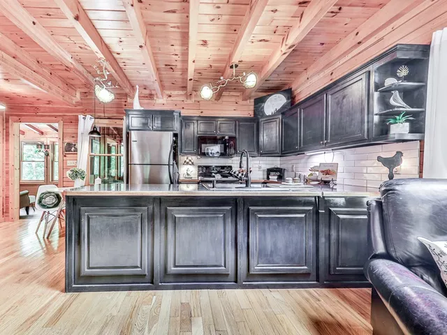 a kitchen with a sink cabinets and window