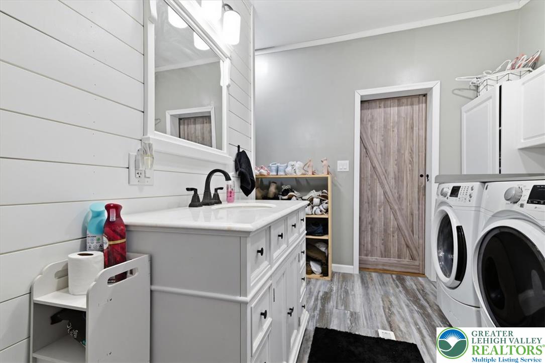 634 Main Road Lehighton, PA 18235 - Photo 22 of 39 Functional utility room featuring a spacious vanity, built-in storage, and a convenient laundry area.
