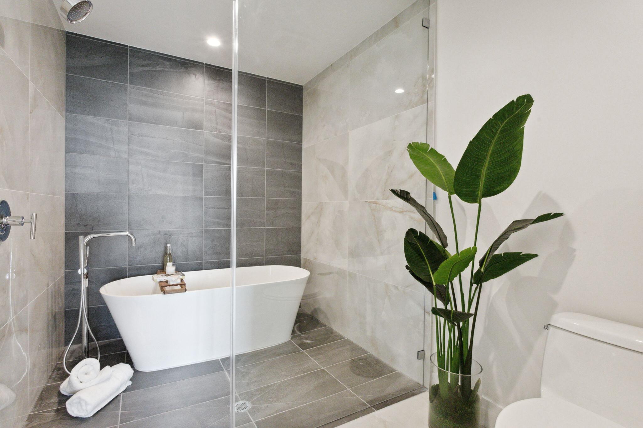 475 East Royal Palm Road, Unit 605 Boca Raton, FL 33432 - Photo 22 of 62 a white bath tub sitting in a bathroom