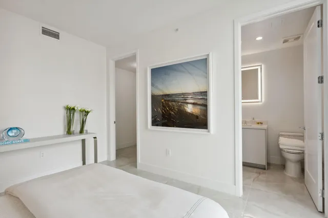 a bathroom with a sink mirror and a shower