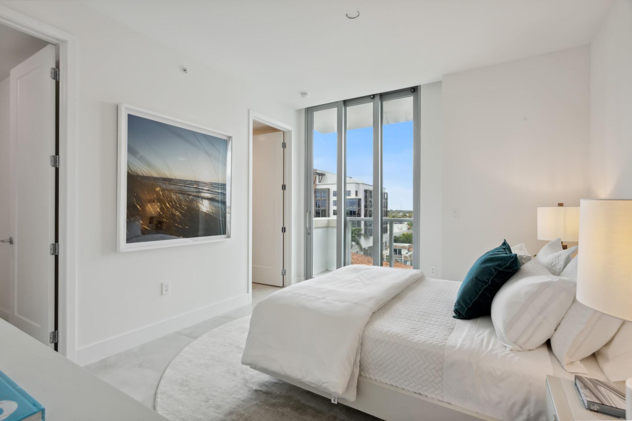 475 East Royal Palm Road, Unit 605 Boca Raton, FL 33432 - Photo 28 of 62 a bedroom with a bed and a painting on the wall