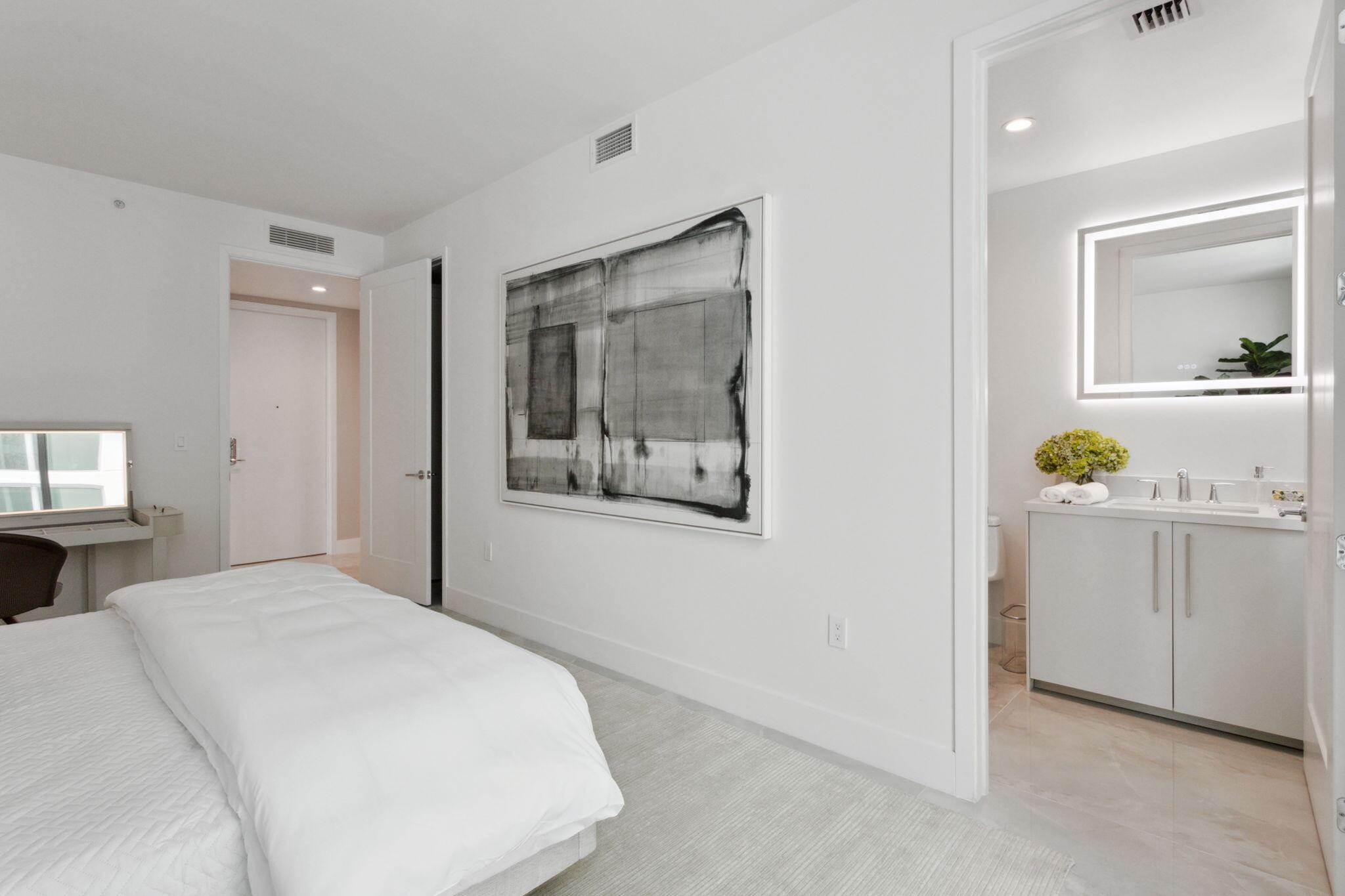 475 East Royal Palm Road, Unit 605 Boca Raton, FL 33432 - Photo 31 of 62 a bedroom with a bed and a cabinets