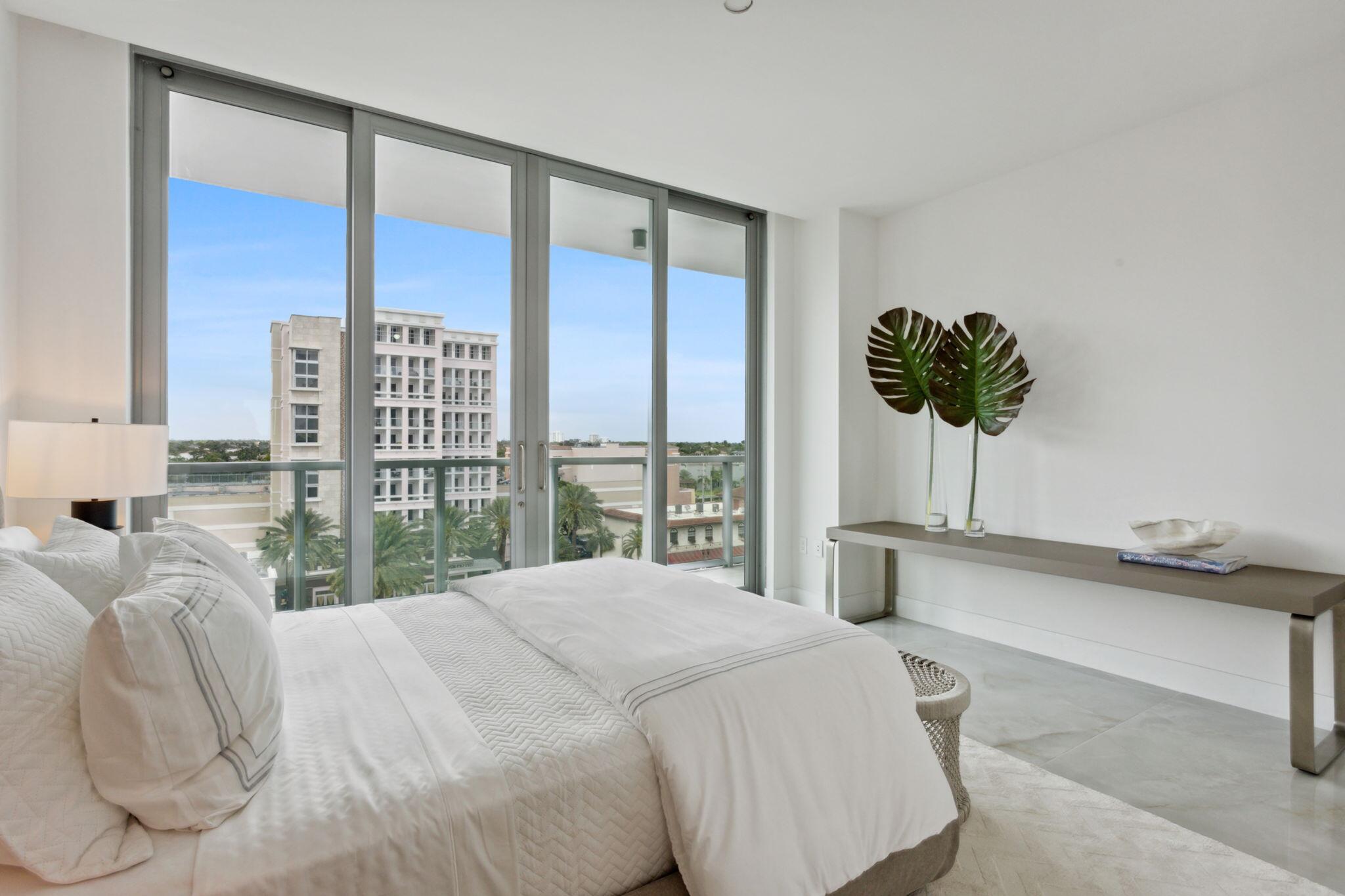 475 East Royal Palm Road, Unit 605 Boca Raton, FL 33432 - Photo 35 of 62 a bedroom with a large bed and a large window