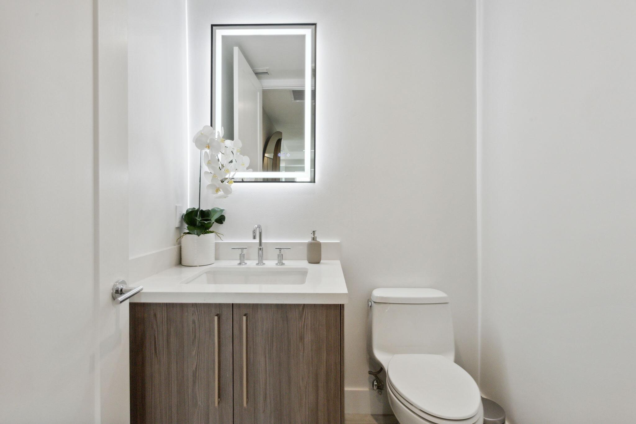 475 East Royal Palm Road, Unit 605 Boca Raton, FL 33432 - Photo 39 of 62 a bathroom with a sink vanity and a toilet