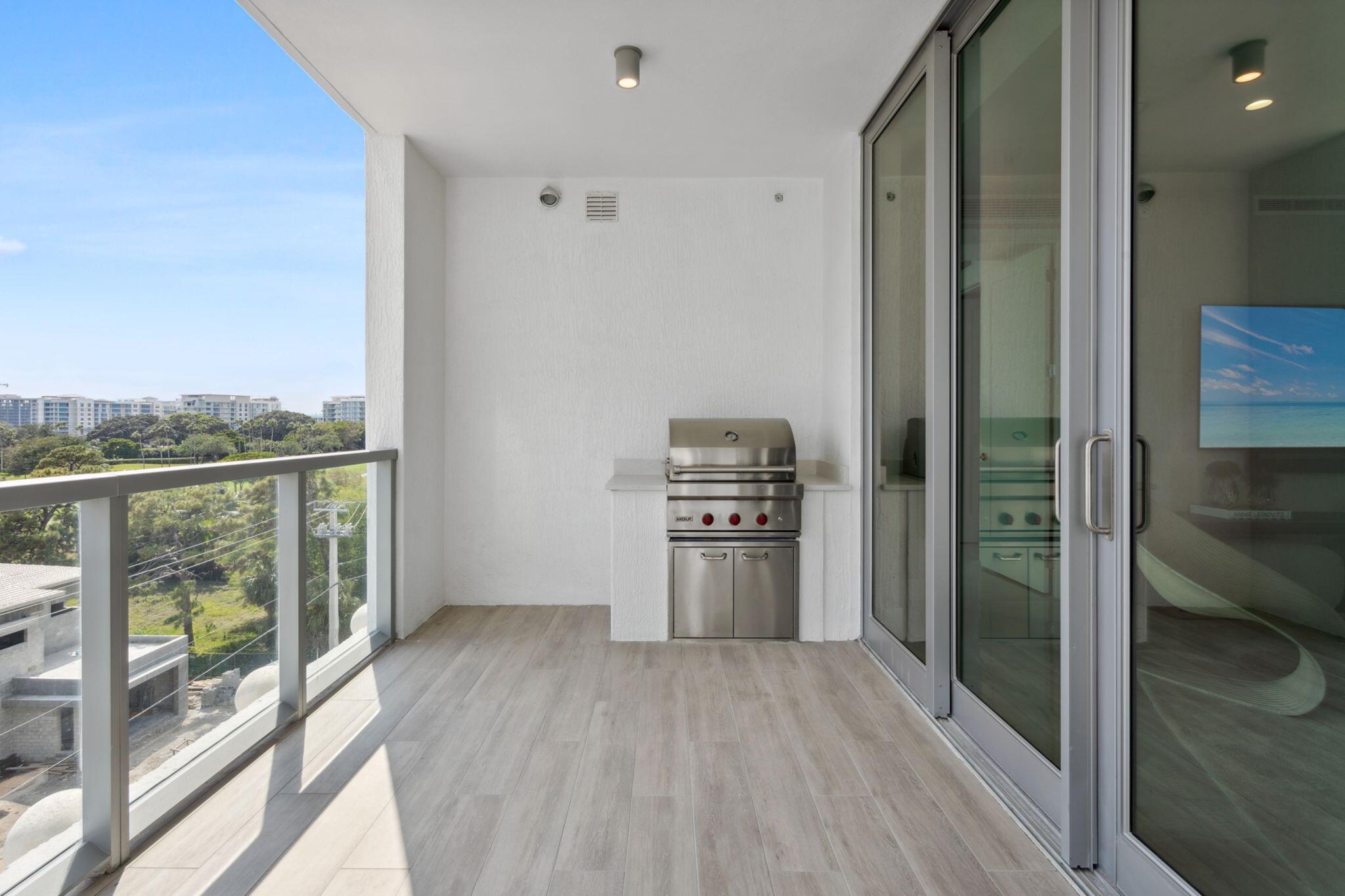 475 East Royal Palm Road, Unit 605 Boca Raton, FL 33432 - Photo 43 of 62 a view of kitchen with stainless steel appliances wooden floor and window
