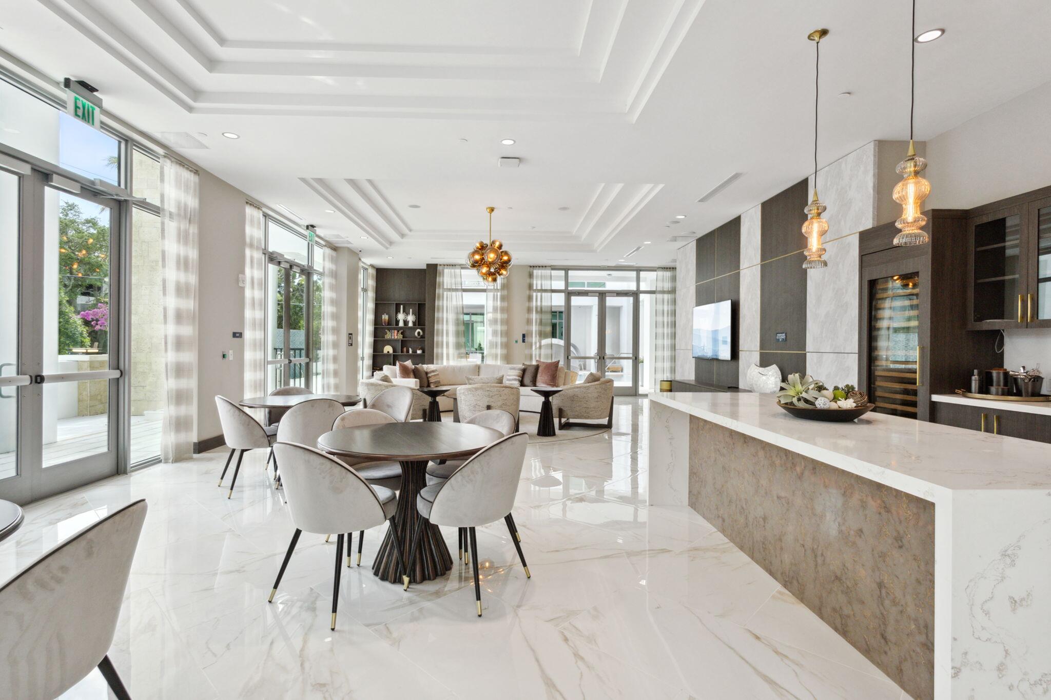 475 East Royal Palm Road, Unit 605 Boca Raton, FL 33432 - Photo 49 of 62 a dining room with furniture a chandelier and wooden floor