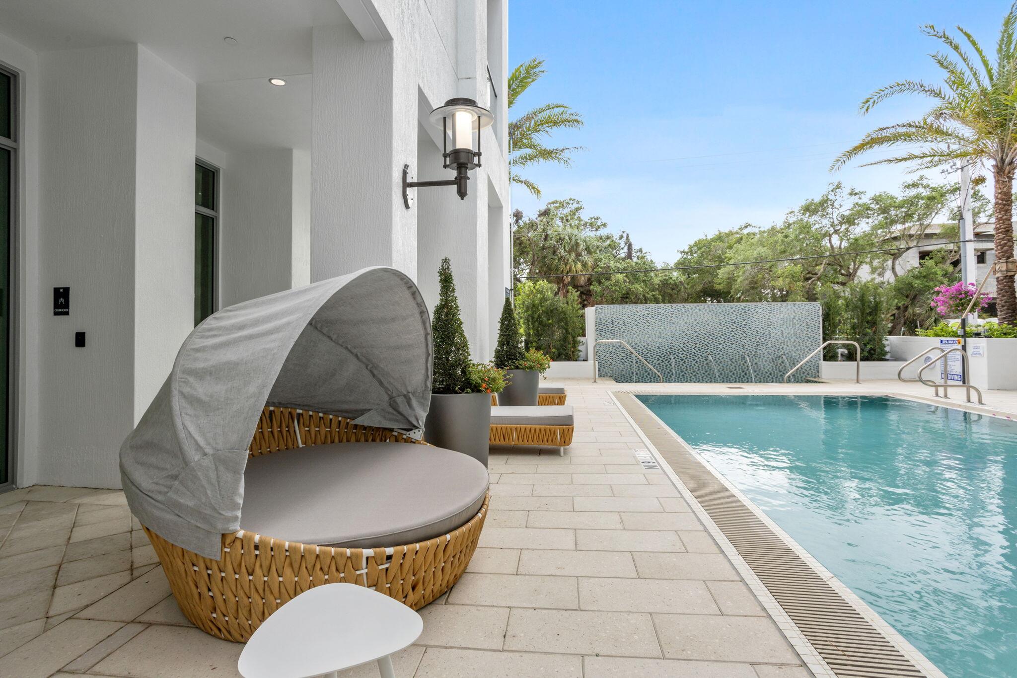 475 East Royal Palm Road, Unit 605 Boca Raton, FL 33432 - Photo 54 of 62 a view of swimming pool with outdoor seating and plants