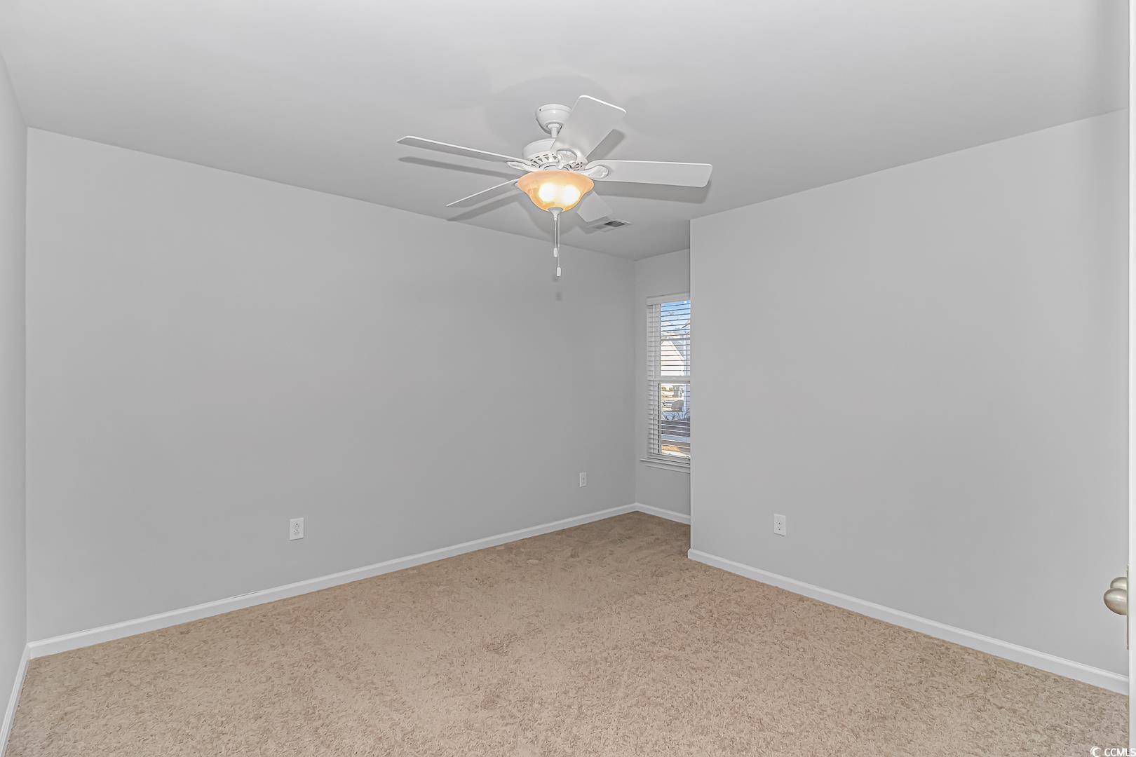 4348 Livorn Loop, Unit 4348 Myrtle Beach, SC 29579 - Photo 20 of 38 Carpeted spare room with ceiling fan