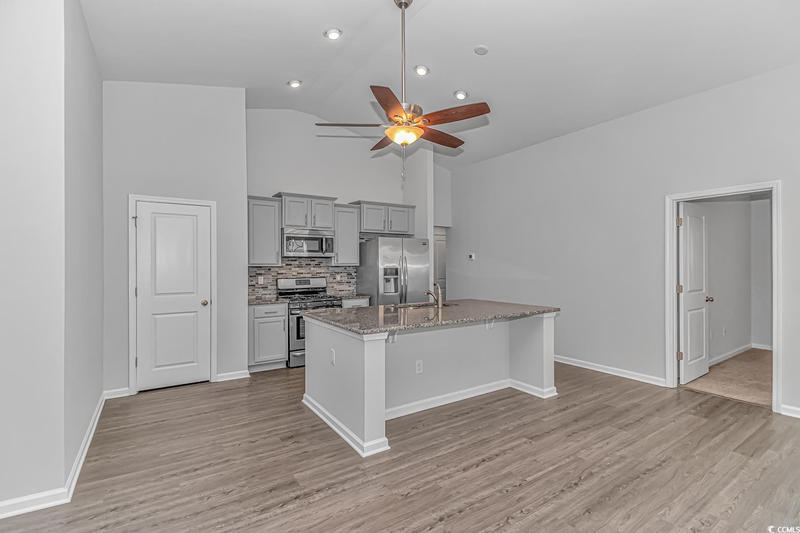 4348 Livorn Loop, Unit 4348 Myrtle Beach, SC 29579 - Photo 4 of 38 Kitchen featuring light stone countertops, stainle