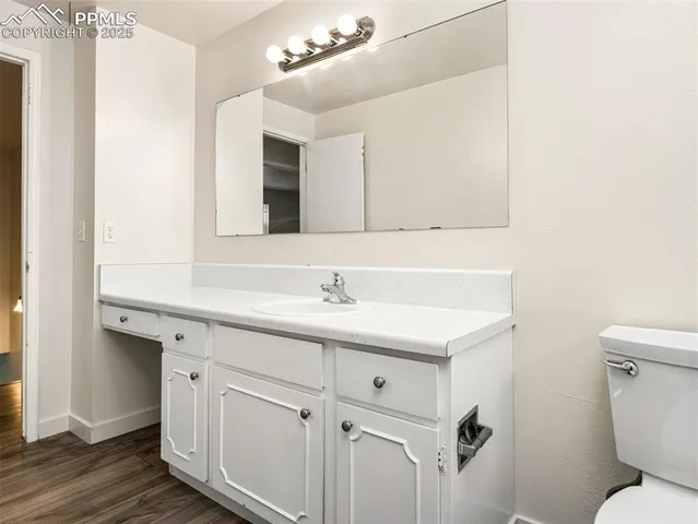 a backyard of a house with a bench