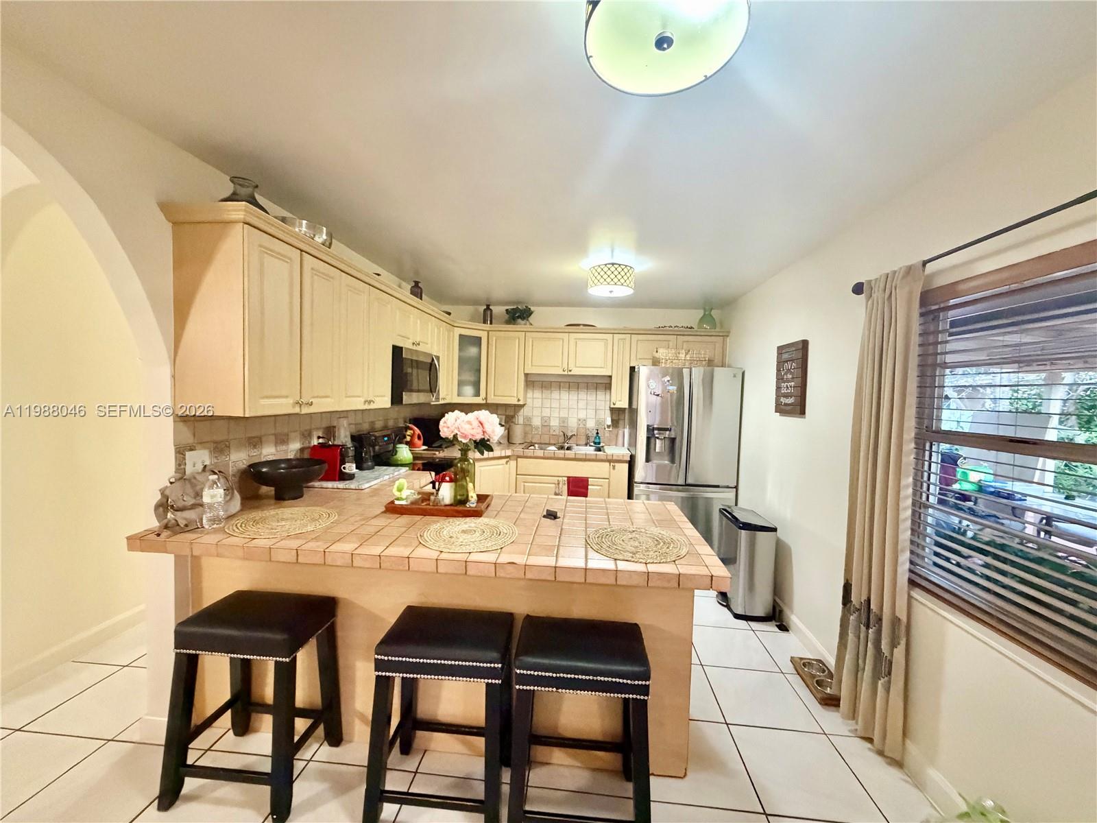 14474 Southwest 293rd Terrace Homestead, FL 33033 - Photo 6 of 20 a large kitchen with a table and chairs