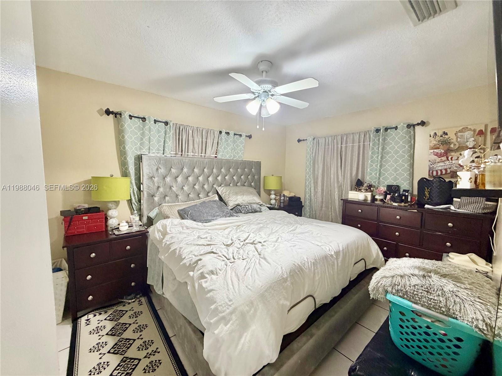 14474 Southwest 293rd Terrace Homestead, FL 33033 - Photo 9 of 20 a bedroom with a bed and a couch