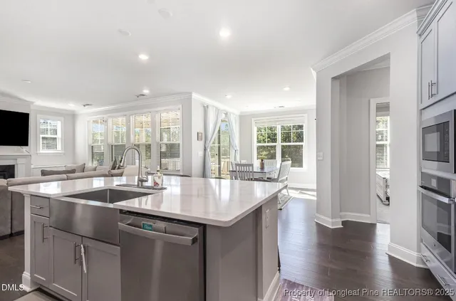 a kitchen with sink and center island