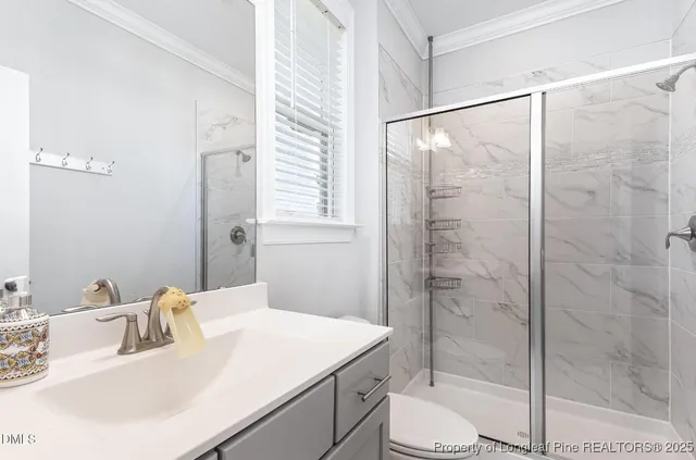 a living room with furniture a window and a book shelf